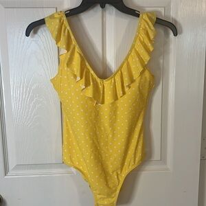 Canary yellow polka dot one-piece bathing suit in size small.